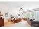 Bedroom with a ceiling fan, study desk, and large window for natural light at 5424 Morris Hunt Dr, Fort Mill, SC 29708