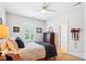 Simple bedroom with window shutters, a ceiling fan, and wooden furniture at 5424 Morris Hunt Dr, Fort Mill, SC 29708