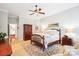 Comfortable bedroom with a ceiling fan, decorative area rug, and neutral wall color at 5424 Morris Hunt Dr, Fort Mill, SC 29708