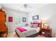 Bedroom with a ceiling fan and a checkered blanket, and natural light from the window at 5424 Morris Hunt Dr, Fort Mill, SC 29708