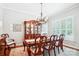 Bright dining room featuring a large window, elegant chandelier, and stylish furnishings at 5424 Morris Hunt Dr, Fort Mill, SC 29708