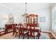 Formal dining room with a large table, chandelier, and beautiful china cabinet at 5424 Morris Hunt Dr, Fort Mill, SC 29708