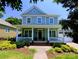 Charming two-story home with a welcoming front porch and meticulously landscaped front yard at 5424 Morris Hunt Dr, Fort Mill, SC 29708