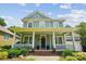 Charming two-story home with a welcoming front porch and manicured landscaping at 5424 Morris Hunt Dr, Fort Mill, SC 29708