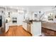 Modern kitchen with stainless steel appliances, a large island, and hardwood floors at 5424 Morris Hunt Dr, Fort Mill, SC 29708