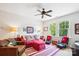 Cozy living room with a ceiling fan, comfortable seating, and cheerful decor at 5424 Morris Hunt Dr, Fort Mill, SC 29708