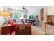 Comfortable sitting room featuring large windows, a ceiling fan, and traditional furnishings at 5424 Morris Hunt Dr, Fort Mill, SC 29708