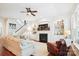 Spacious living room with a fireplace, built-in shelving, and comfortable seating at 5424 Morris Hunt Dr, Fort Mill, SC 29708