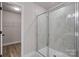Modern bathroom featuring a glass shower, spacious walk-in closet, and contemporary design, offering comfort and convenience at 6712 W Sugar Creek Rd, Charlotte, NC 28269