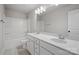 This bathroom features a double sink vanity, a large mirror, and a shower-tub combo at 6712 W Sugar Creek Rd, Charlotte, NC 28269