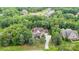 Serene aerial shot of a home surrounded by a dense, green forest at 6873 Pine Moss Ln, Clover, SC 29710