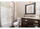 Cozy bathroom features a shower-tub combination and vanity with stone countertop at 6873 Pine Moss Ln, Clover, SC 29710