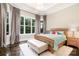 This bedroom features an accent rug and large windows providing plentiful natural light at 6873 Pine Moss Ln, Clover, SC 29710
