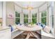 Cozy breakfast nook featuring a round table, bench seating, and large windows at 6873 Pine Moss Ln, Clover, SC 29710
