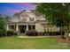 Charming traditional home with covered front porch, manicured lawn, and beautiful landscaping at 6873 Pine Moss Ln, Clover, SC 29710