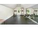 Well-lit home gym featuring a mirrored wall and a variety of exercise equipment at 6873 Pine Moss Ln, Clover, SC 29710