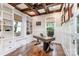 Cozy home office with custom built-ins, a coffered ceiling, and ample natural light at 6873 Pine Moss Ln, Clover, SC 29710