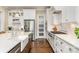 Spacious kitchen with stainless steel appliances, white cabinets, and a farmhouse sink at 6873 Pine Moss Ln, Clover, SC 29710