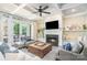 Bright living room with a fireplace, coffered ceiling, and French doors leading to the patio at 6873 Pine Moss Ln, Clover, SC 29710