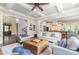Open-concept living room with a view of the kitchen, staircase, and front door at 6873 Pine Moss Ln, Clover, SC 29710
