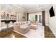 Spacious living room with large sectional, high ceilings, and bar area, great for entertaining at 6873 Pine Moss Ln, Clover, SC 29710