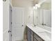 Bright bathroom featuring double sinks and vanity with shower and toilet at 705 Vintage Creek Dr, Matthews, NC 28104