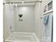 Bright bathroom with a tiled shower-tub combination with plant decoration at 705 Vintage Creek Dr, Matthews, NC 28104