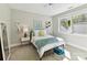 Bright bedroom with natural light, light colored carpet and ceiling fan at 705 Vintage Creek Dr, Matthews, NC 28104