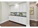 Butler's pantry with custom white cabinets, counter space, and decorative accents at 705 Vintage Creek Dr, Matthews, NC 28104
