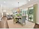 Open-concept dining area adjacent to the kitchen and leading to the outdoor patio at 705 Vintage Creek Dr, Matthews, NC 28104