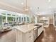 Open-concept kitchen with a large island, stainless steel appliances, and a view into the adjacent living room at 705 Vintage Creek Dr, Matthews, NC 28104