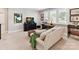 Cozy living room featuring a comfortable couch, desk area and a relaxing atmosphere at 705 Vintage Creek Dr, Matthews, NC 28104