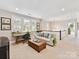 Upstairs living room with desk, couch, and a large window at 705 Vintage Creek Dr, Matthews, NC 28104