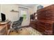Bedroom features a window, desk, office chair and a large set of drawers at 7304 Pebblestone Dr, Charlotte, NC 28212
