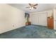 Spacious bedroom with double closets and carpeted floors, ready for personalization at 7304 Pebblestone Dr, Charlotte, NC 28212