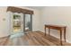 Bright dining area features wood floors and sliding glass doors to the backyard deck at 7304 Pebblestone Dr, Charlotte, NC 28212