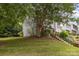 Exterior of home with mature landscaping and shady trees for comfortable living during the hot summer months at 7304 Pebblestone Dr, Charlotte, NC 28212
