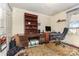 Home office features a desk, shelves, and a window for natural light at 7304 Pebblestone Dr, Charlotte, NC 28212