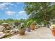 Sidewalk and colorful flower pots throughout the exterior, creating a vibrant and inviting path at 7304 Pebblestone Dr, Charlotte, NC 28212