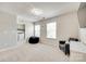 Bedroom featuring a laundry room, natural lighting, and carpeted floors at 7930 Kelburn Ln, Charlotte, NC 28273