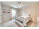 Cozy bedroom with a board and batten accent wall, carpet, and white furniture at 7930 Kelburn Ln, Charlotte, NC 28273