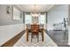 Elegant dining room boasting hardwood floors, wainscoting, and ample seating at 7930 Kelburn Ln, Charlotte, NC 28273
