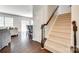 Entryway area showcasing the hardwood floors leading to carpeted stairs at 7930 Kelburn Ln, Charlotte, NC 28273