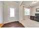 Bright entryway showcasing a stylish front door, beautiful floors, and a home office at 7930 Kelburn Ln, Charlotte, NC 28273