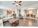 Bright and airy living room with hardwood floors, seamlessly connected to the kitchen and dining area at 7930 Kelburn Ln, Charlotte, NC 28273