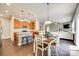 Kitchen leading into the dining and living areas creating a comfortable flow at 7930 Kelburn Ln, Charlotte, NC 28273