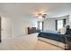 Spacious main bedroom featuring a ceiling fan, carpet flooring, ensuite bathroom entrance, and dresser at 7930 Kelburn Ln, Charlotte, NC 28273