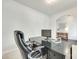 Comfortable home office setup featuring a spacious desk and a view into the hallway at 7930 Kelburn Ln, Charlotte, NC 28273