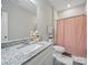 Bright bathroom featuring granite countertop vanity and a neutral color palette at 900 4Th St, Spencer, NC 28159