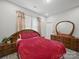 Cozy bedroom with ample natural light, matching dresser, and neutral walls at 900 4Th St, Spencer, NC 28159
